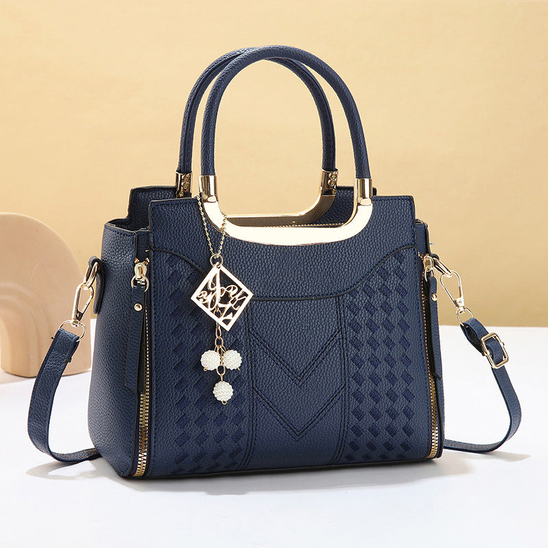 Heidi | Bolso de mano para mujer con costura en V – herrajes dorados, múltiples compartimentos y asa de mano